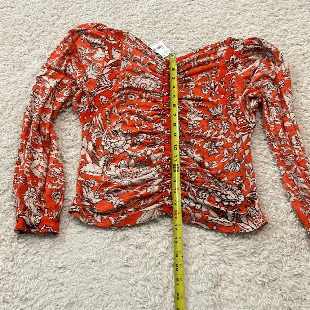 NWT FREE PEOPLE M Say the Word top with balloon sleeves in funky V neck style